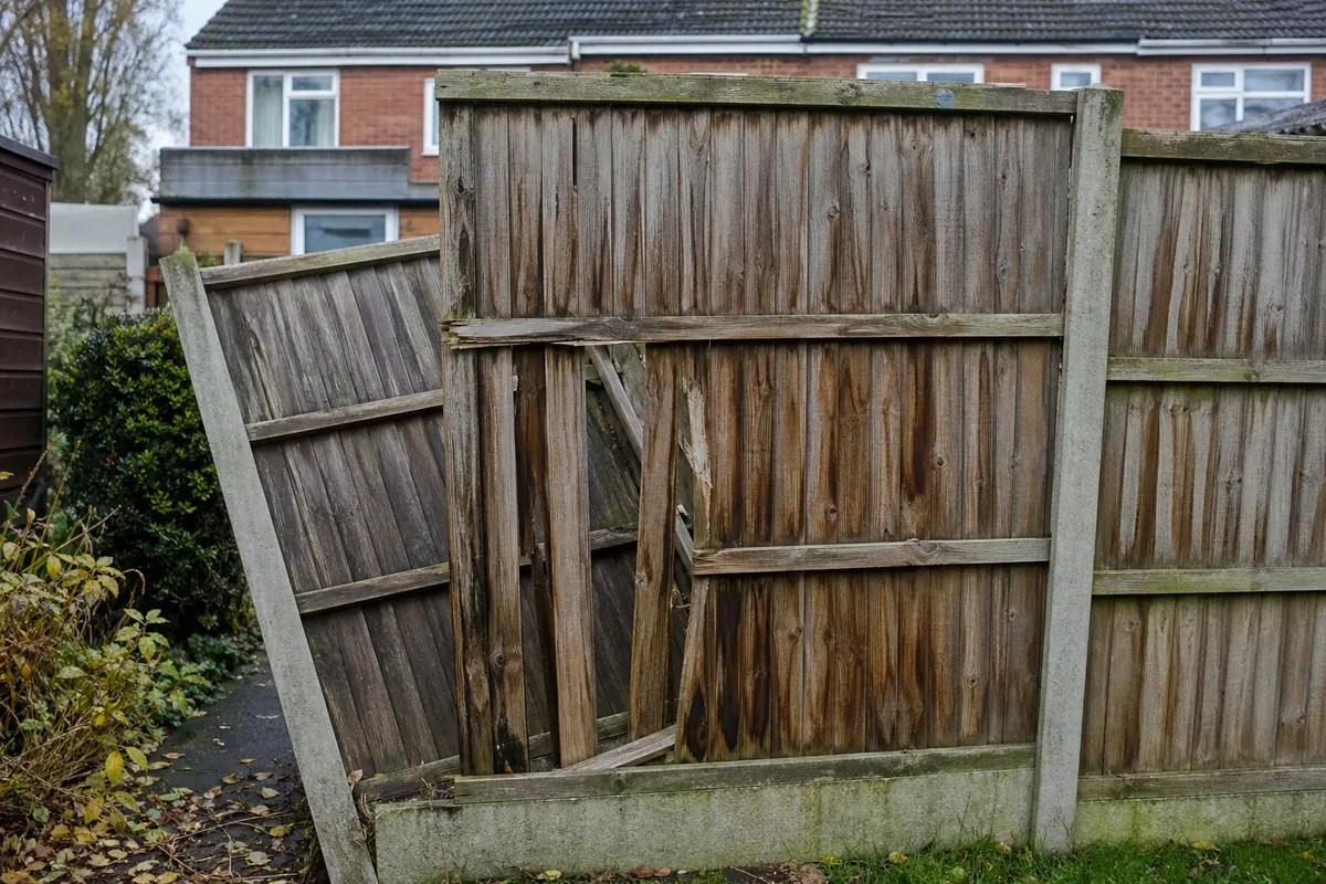 Damaged garden fence being repaired in Leicester